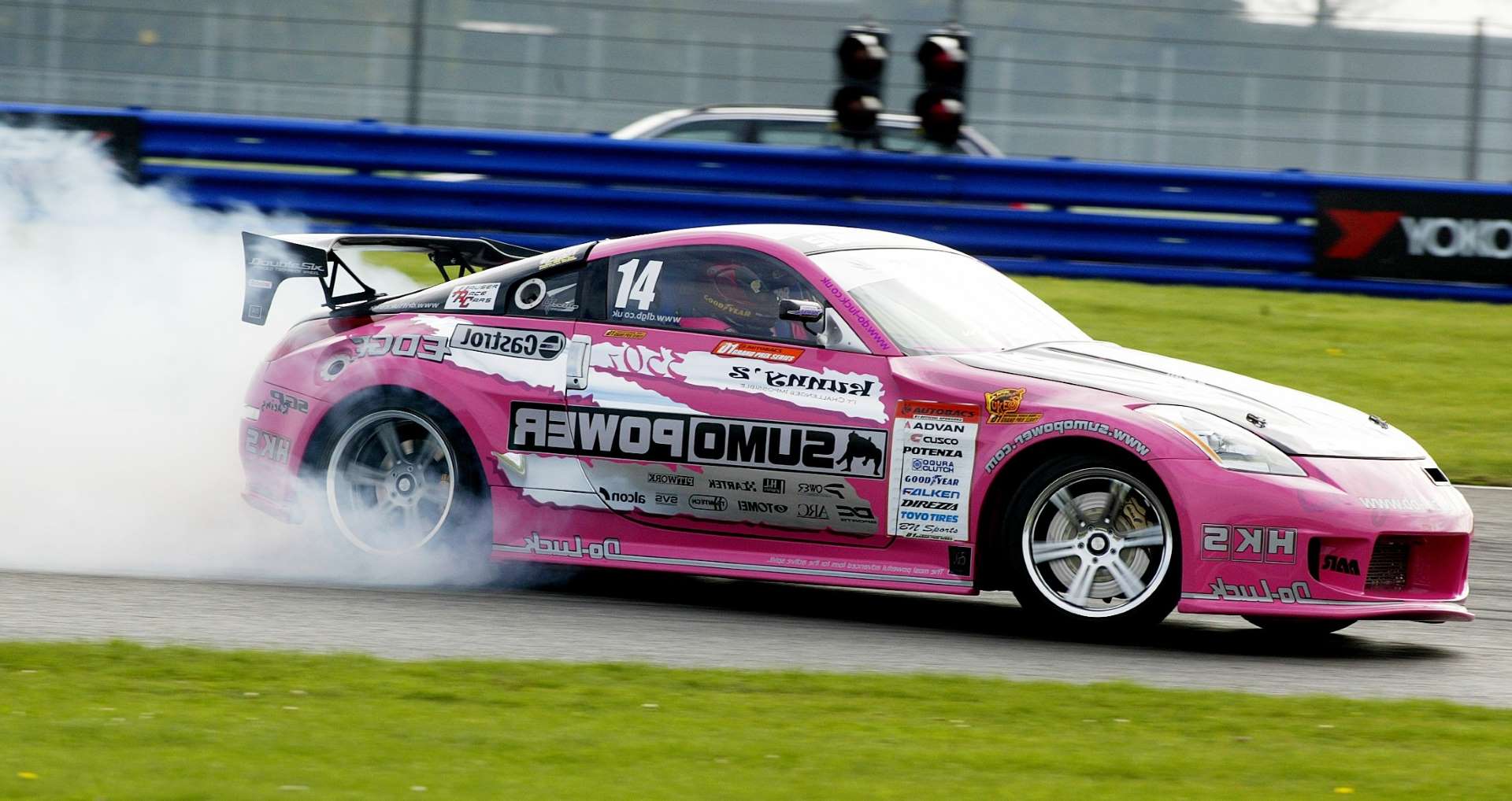 pink drift car on a race track