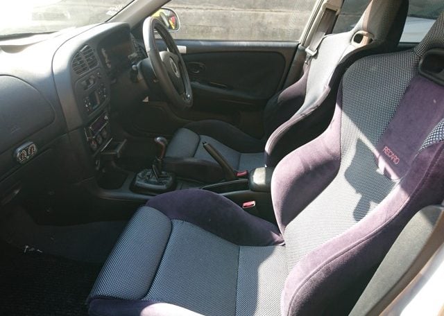 Used Lancer Evo for import from Japan via Japan Car Direct. Interior cockpit passenger side