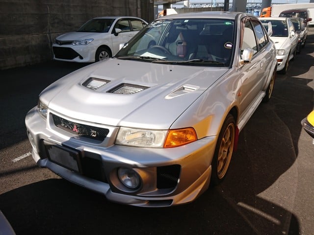 S and E Lancer Evo to NZ IN TEXT PHOTO 1. Mitsubishi Lancer GSR Evolution V from Japan. Now can be imported New Zealand
