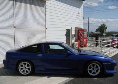 Blue JDM 1990 Nissan 180SX with 175 hp engine and 5-speed manual transmission in nearly stock condition