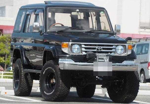 Front view of Toyota Land Cruiser 4WD with custom winch