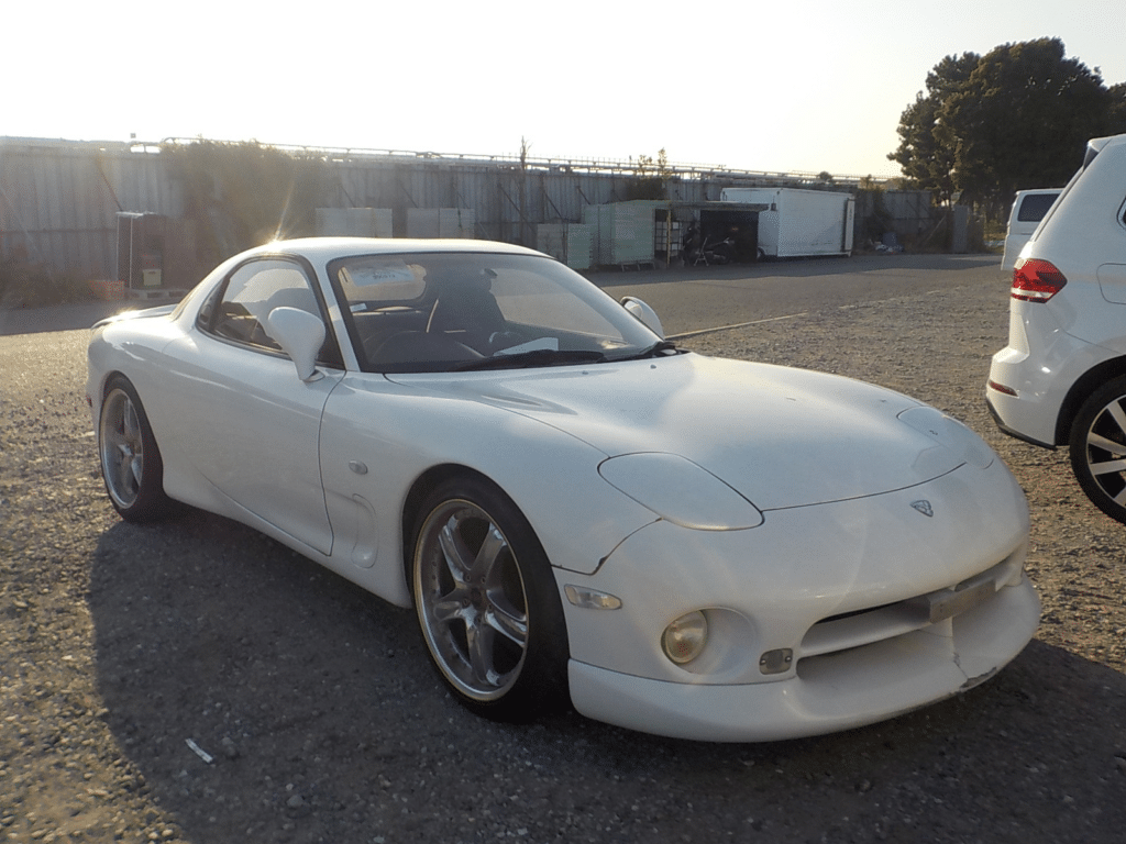 Mazda RX-7, FD3S, FD, Rotary Engine, Sports Car, JDM, Performance Vehicle, Turbocharged, Rotary Power, Iconic Design, Lightweight, Driving Experience, Import from Japan, Japanese Sports Car, Classic Car