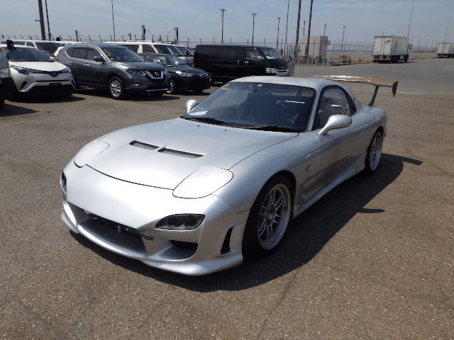 Mazda RX-7, JDM sports car, Rotary engine, body kit, spoiler, Iconic design, Turbocharged power, Performance legend, Tuner's favorite, Timeless classic, Japan Car Direct