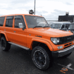 Toyota Land Cruiser Prado, Orange Land Cruiser Japan, Buy Used Land Cruiser, Offroad Toyota Prado, 4WD Land Cruiser Japan, Japanese SUV Export, Land Cruiser Prado Diesel, Reliable Offroad SUV, Import Toyota Prado, Japan Car Direct
