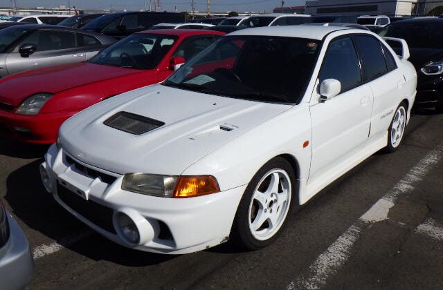 Mitsubishi Lancer Evolution IV (06 Feb 2026) Mitsubishi Lancer Evolution IV, Used Mitsubishi Evo 4, JDM Lancer Evolution IV, Mitsubishi Evo 4 White, Mitsubishi Evo 4 Large Wing, Japan Used Car Auctions, Lancer Evo Import From Japan, Used Cars Export Japan, Export Cars From Japan, Japan Car Direct, CN9A, 4G63